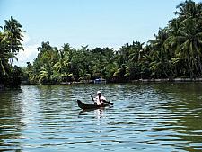 Old Man crossing the lake in Boad Alleppey Kerala