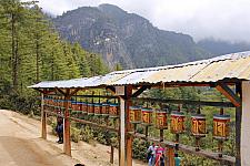 Prayer-wheel-near-taksang-cafe-and-Tigers-nest-behind